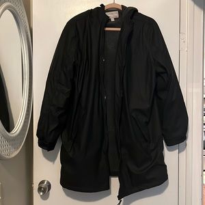 Black water resistant rain coat size 18/20 never worn